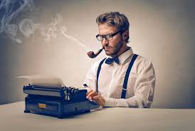 man typing on typewriter